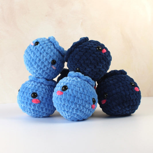 Crochet blueberry plushies, handmade amigurumi fruit set in blue yarn with embroidered faces.