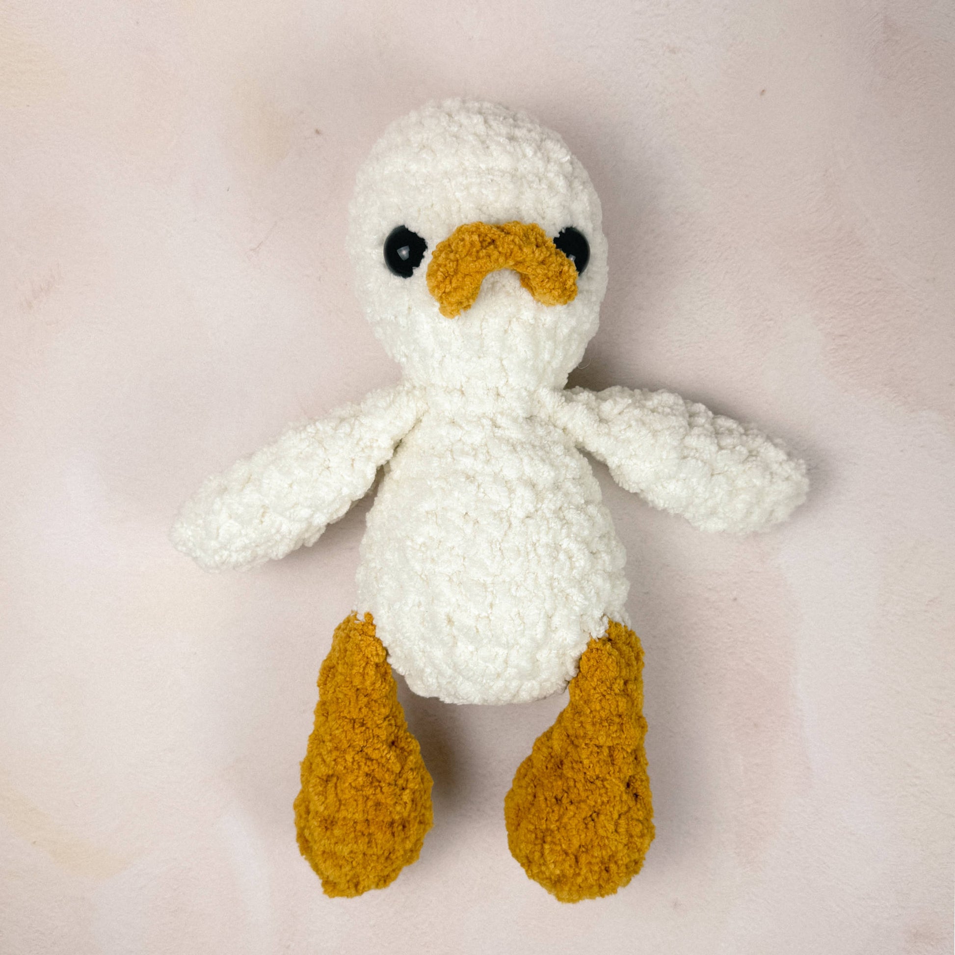 Duck plush shown on a neutral background to display size and texture.